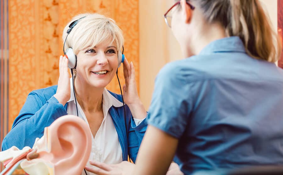 deaf woman takes a hearing test